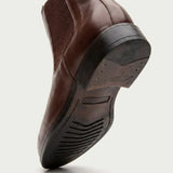 Detalhe do solado e do salto da Bota Chelsea Masculina Londres marrom.