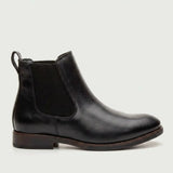 Bota Chelsea Masculina Londres preta, em vista lateral com elástico e salto baixo.