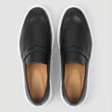 Par do modelo Mocassim Torino Ripple Tratorado de Couro, na cor preto, visto de cima.
