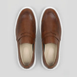 Par do modelo Mocassim Torino Ripple Tratorado de Couro, na cor marrom, visto de cima.
