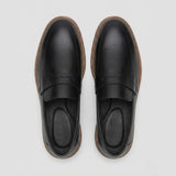Par do modelo Mocassim Tratorado Torino Ripple, na cor preto, visto de cima.